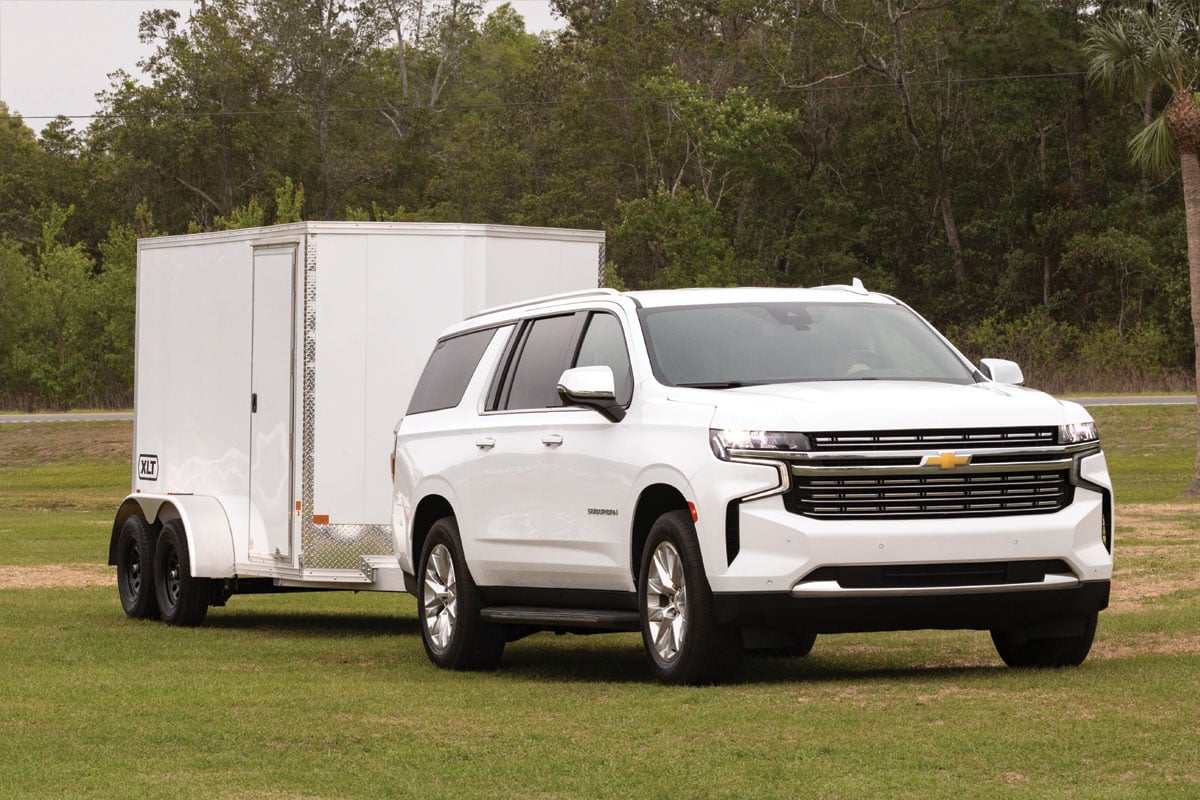White SUV parked on grass with 7 wide white XLT Pro trailer